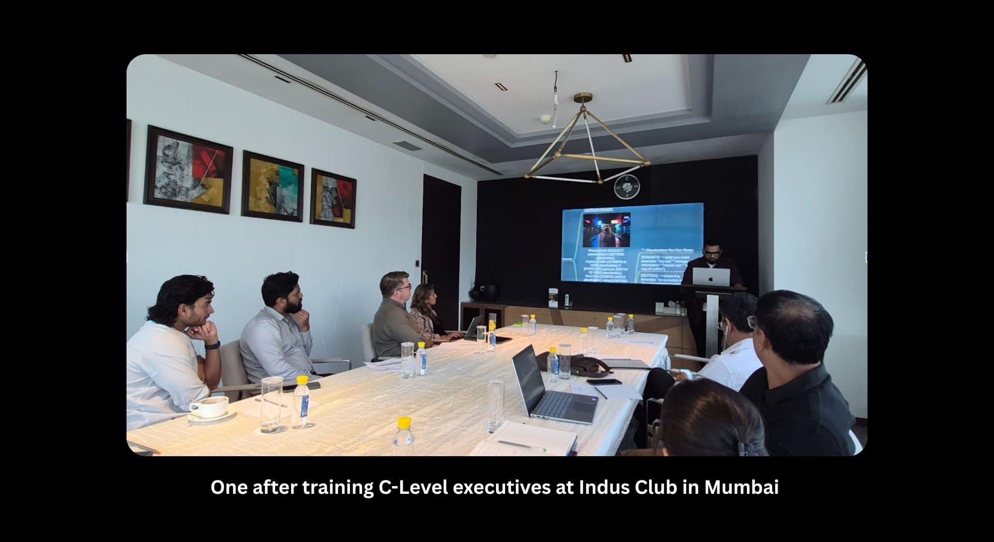 Rishi Jain leading a C-level AI briefing at The Indus Club, Mumbai.
