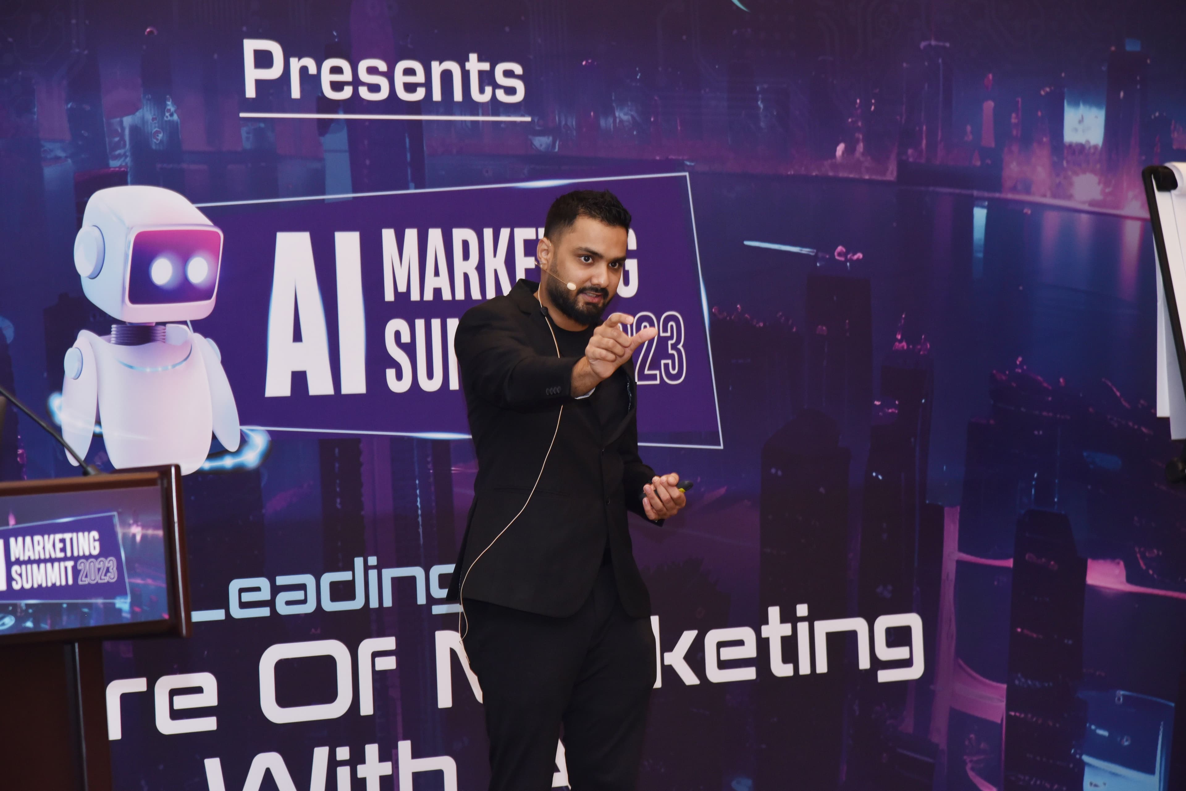 Rishi Jain speaking on stage